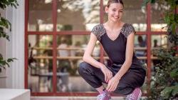 Jennifer Burlage crouched in University Hall courtyard